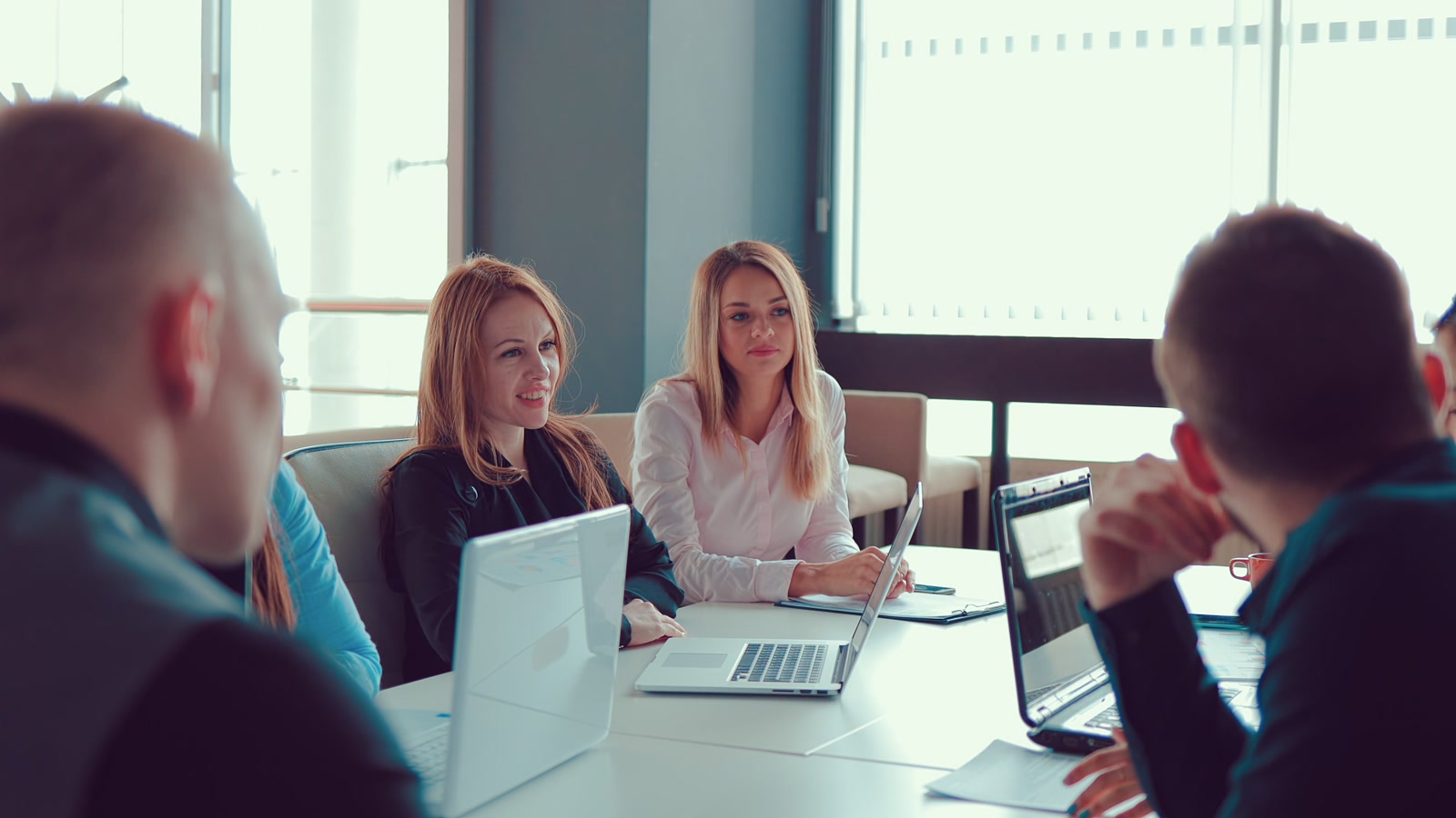 Small business team meeting around a table in an office